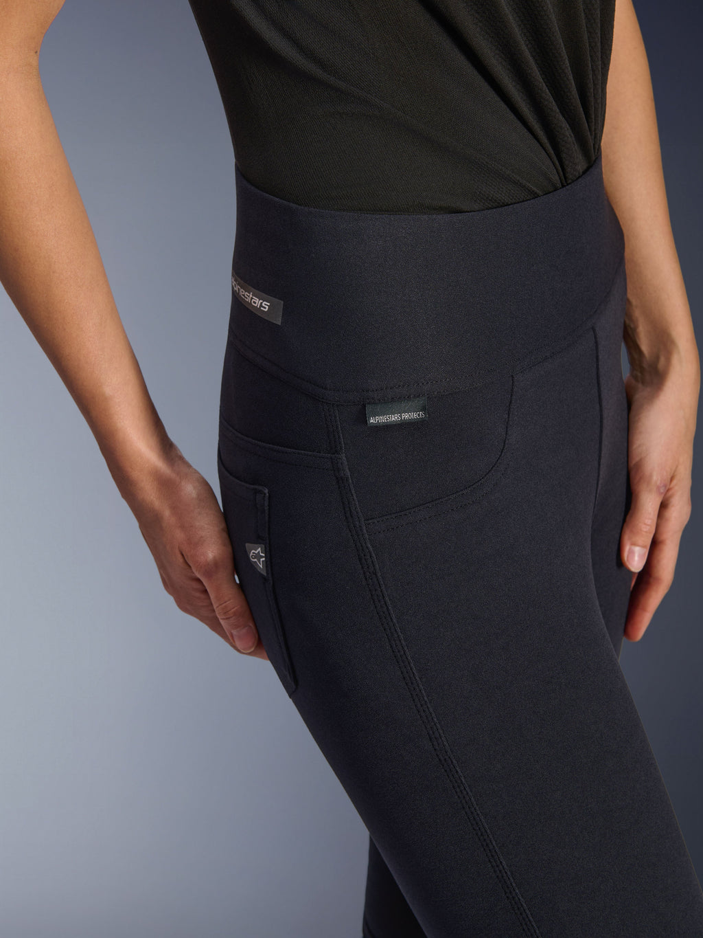 Alpinestars Stella Flex-Ast Leggings, Women's Motorcycle Riding Leggings, Black, close-up shot of high waistband and hip area featuring subtle branding tags, sleek urban design for road riding