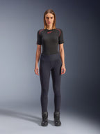 Alpinestars Stella Flex-Ast Leggings, Woman's Motorcycle Leggings, Black, worn with a black short-sleeved top with red details and black riding boots, slim-fit contemporary urban riding gear, front view
