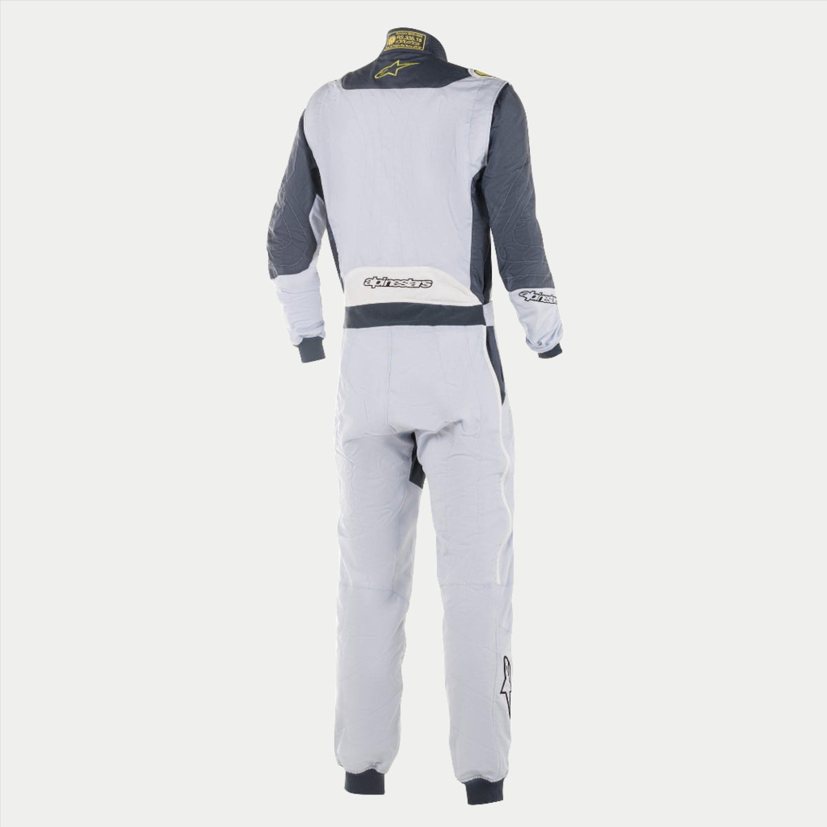 Alpinestars GP Pro Comp Suit, Professional Auto Racing Suit, Silver and Asphalt Gray, rear view showing light gray main body with dark gray shoulder panels, white lower back panel with Alpinestars logo, and lime yellow accents on the collar