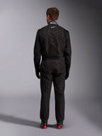 Alpinestars KMX-9 V3 Suit, Karting Suit, Black and White, rear view showing white contrast stitching, FIA homologation label on the collar, and stretch panels for mobility