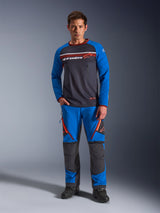 Alpinestars Maxdura Dual Jersey, Motorcycle Jersey, Deep Gray and Royal Blue, full mesh torso with padded sleeves and zippered chest pockets, featuring white and orange Alpinestars logo, worn with matching adventure pants and black boots