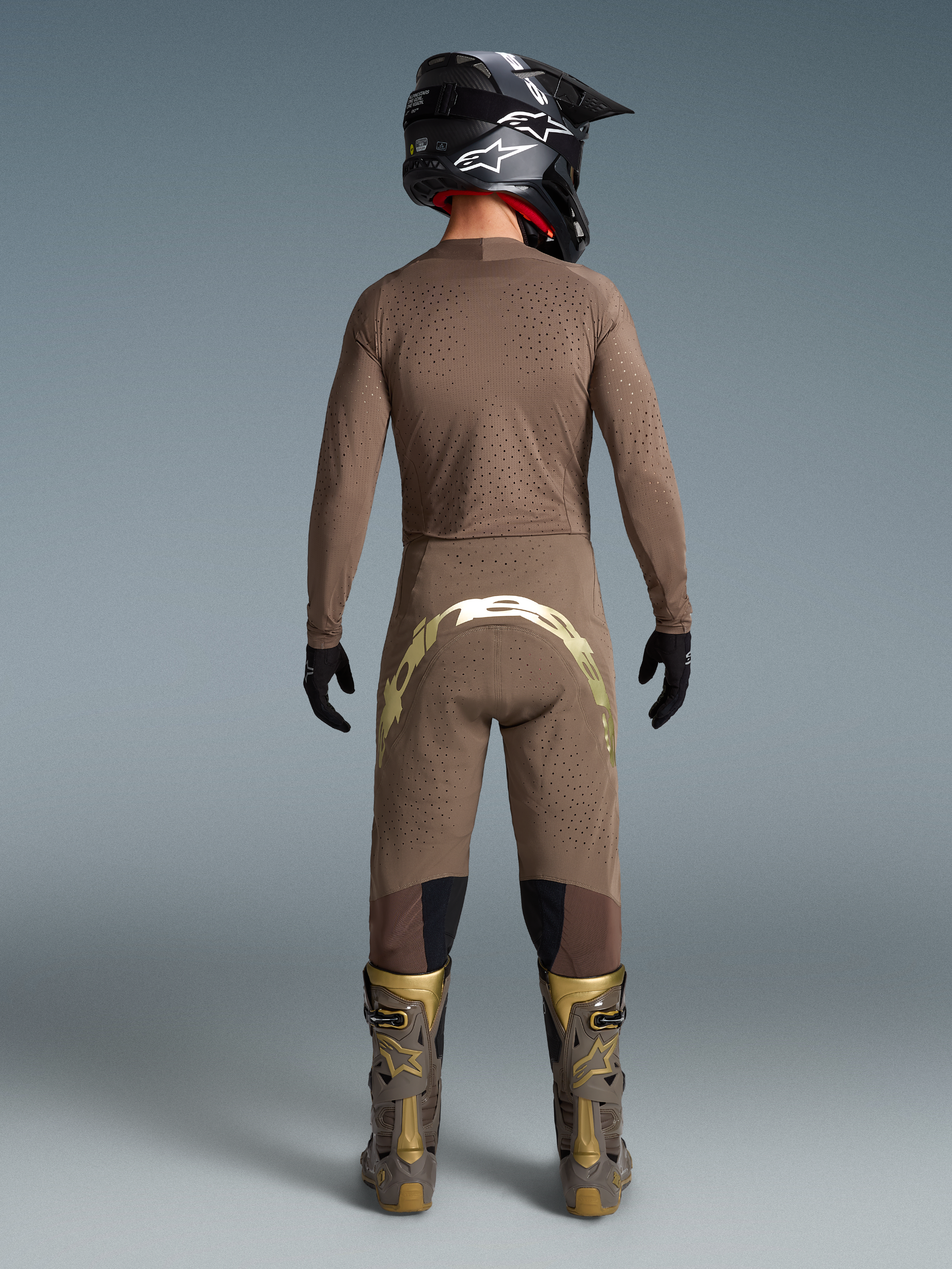 Alpinestars Limited Edition Supertech Air Gold Jersey, Motocross Gear for Men, Earth Brown and Gold, featuring ventilated mesh.