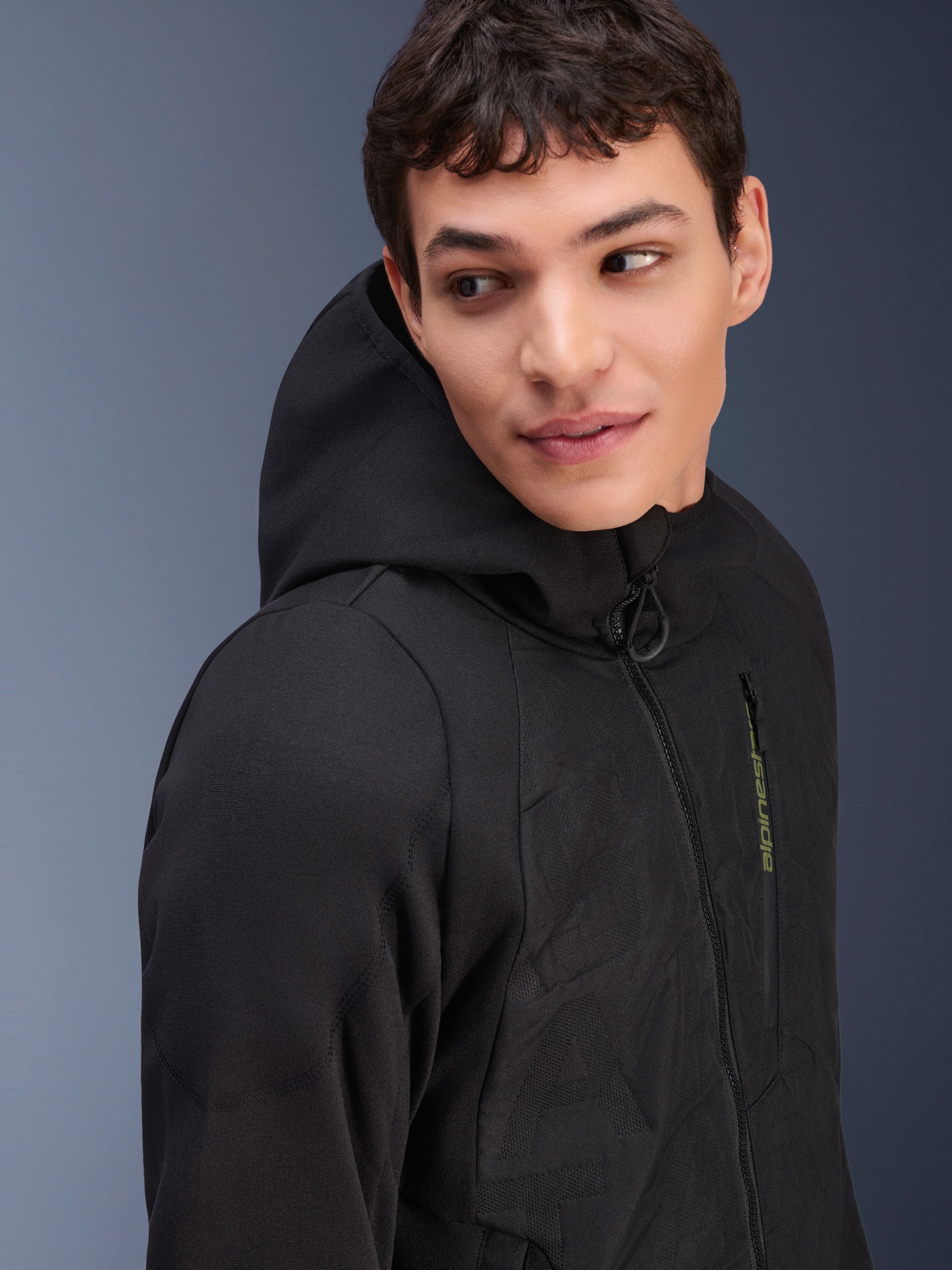 Alpinestars MO.ST.EQ Hybrid Hooded Jacket, Black, mid-season padded motorcycle hoodie, featuring an angled front zipper, textured seamless panels, and green Alpinestars branding, modern urban streetwear design