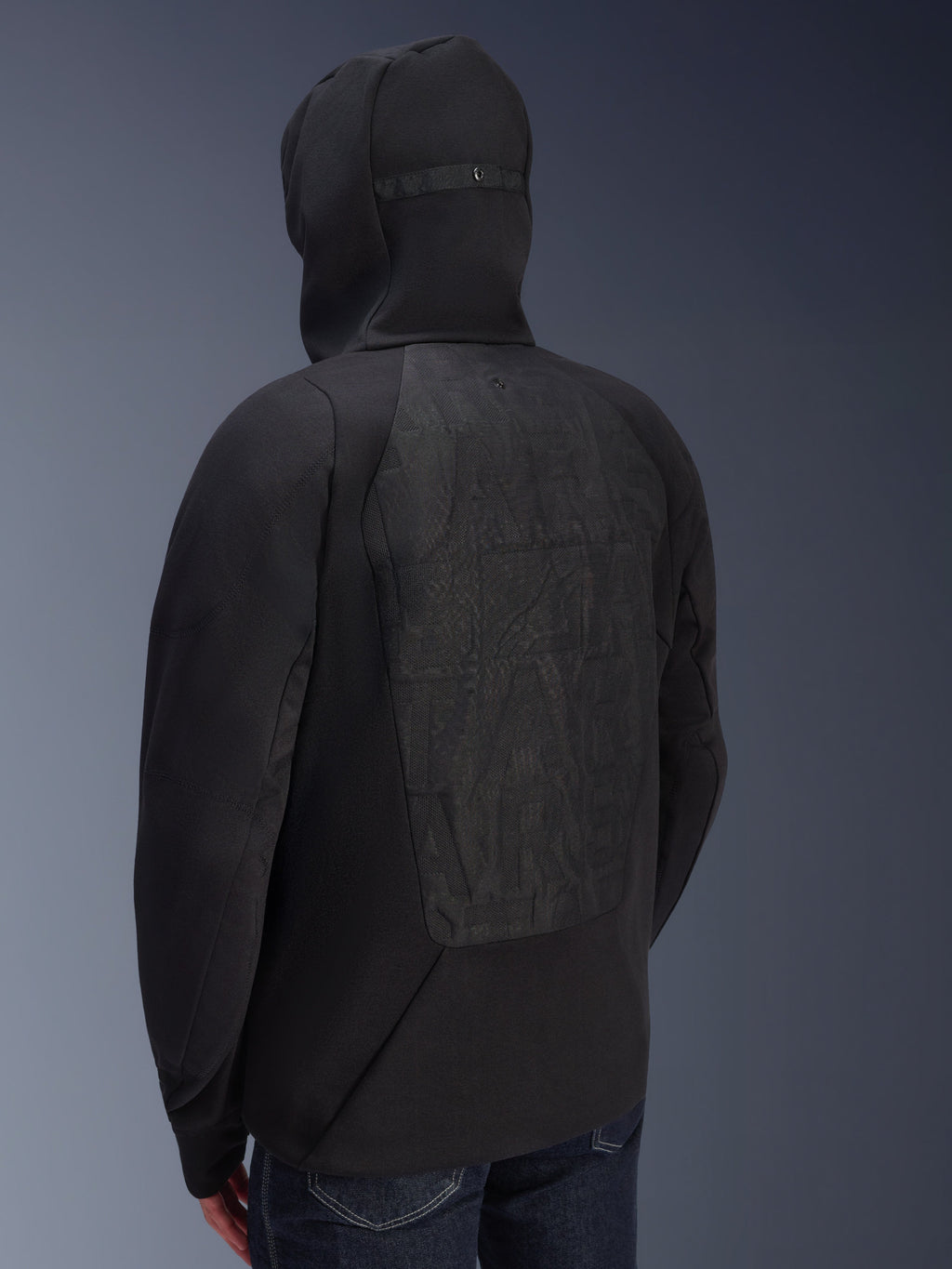 Alpinestars MO.ST.EQ Hybrid Hooded Jacket, back view, black padded motorcycle hoodie, seamless back panel with subtle tonal graphic, hood with retention snap, urban streetwear style for riders