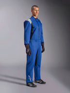 Alpinestars Kart Indoor V2 Suit, Blue Karting Suit, one-piece racing overall with white shoulder panels and logos, adjustable waist belt, white logo on lower leg, worn by model with black racing gloves and shoes, motorsport apparel for indoor karting