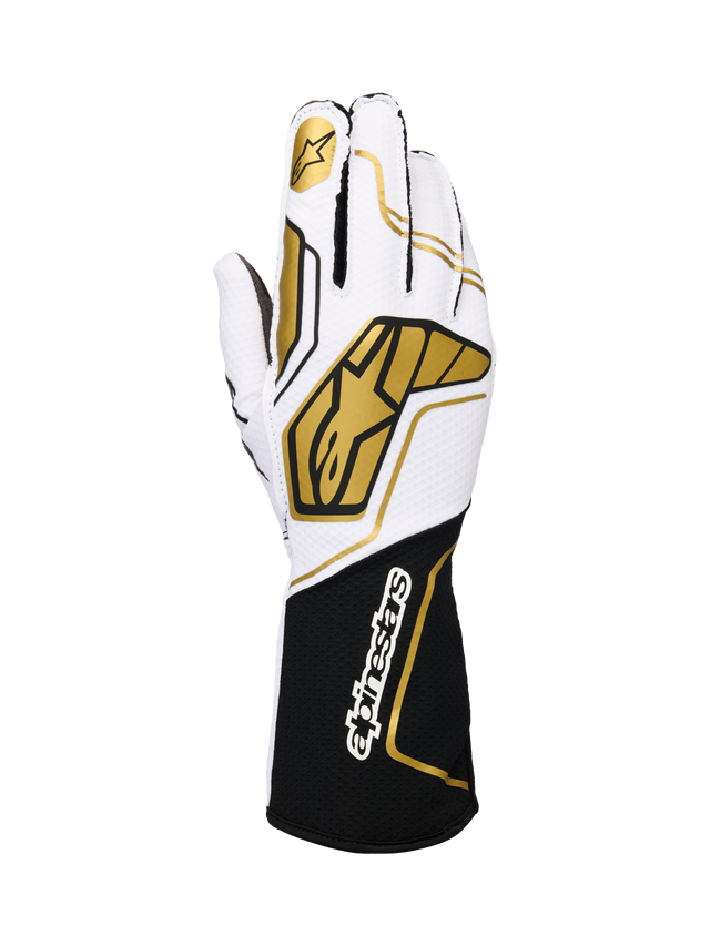 Alpinestars Tech-1 KX V4 Gloves, karting racing gloves, white and black with gold accents, featuring a gold star logo on the index finger and large gold geometric patterns on the back, breathable mesh construction with a black cuff and white branding, ergonomic design for motorsport performance.