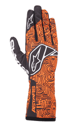 Alpinestars Tech-1 K Race V2 Vertical Gloves, Karting Racing Gloves, Orange Fluo and Black, featuring an intricate black maze-like geometric pattern, white Alpinestars logo on the back and index finger, ASTARS branding on the side wrist, lightweight breathable mesh design