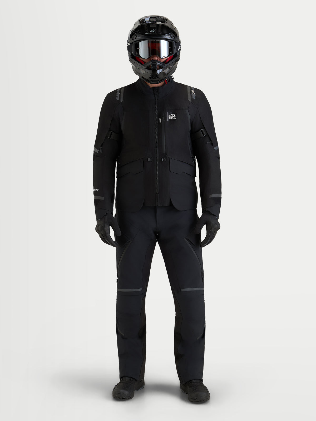 Alpinestars St-7 V2 2L Gore-Tex Jacket, Men's Black waterproof adventure motorcycle jacket with direct ventilation and matching black riding pants, worn with a helmet