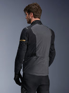 Alpinestars ST-7 2L GORE-TEX Jacket, Motorcycle Jacket, Deep Gray Black and Dark Khaki, rear view showing large gray back panel with subtle branding, black sleeves with gold-toned khaki accents, adventure-ready waterproof textile design