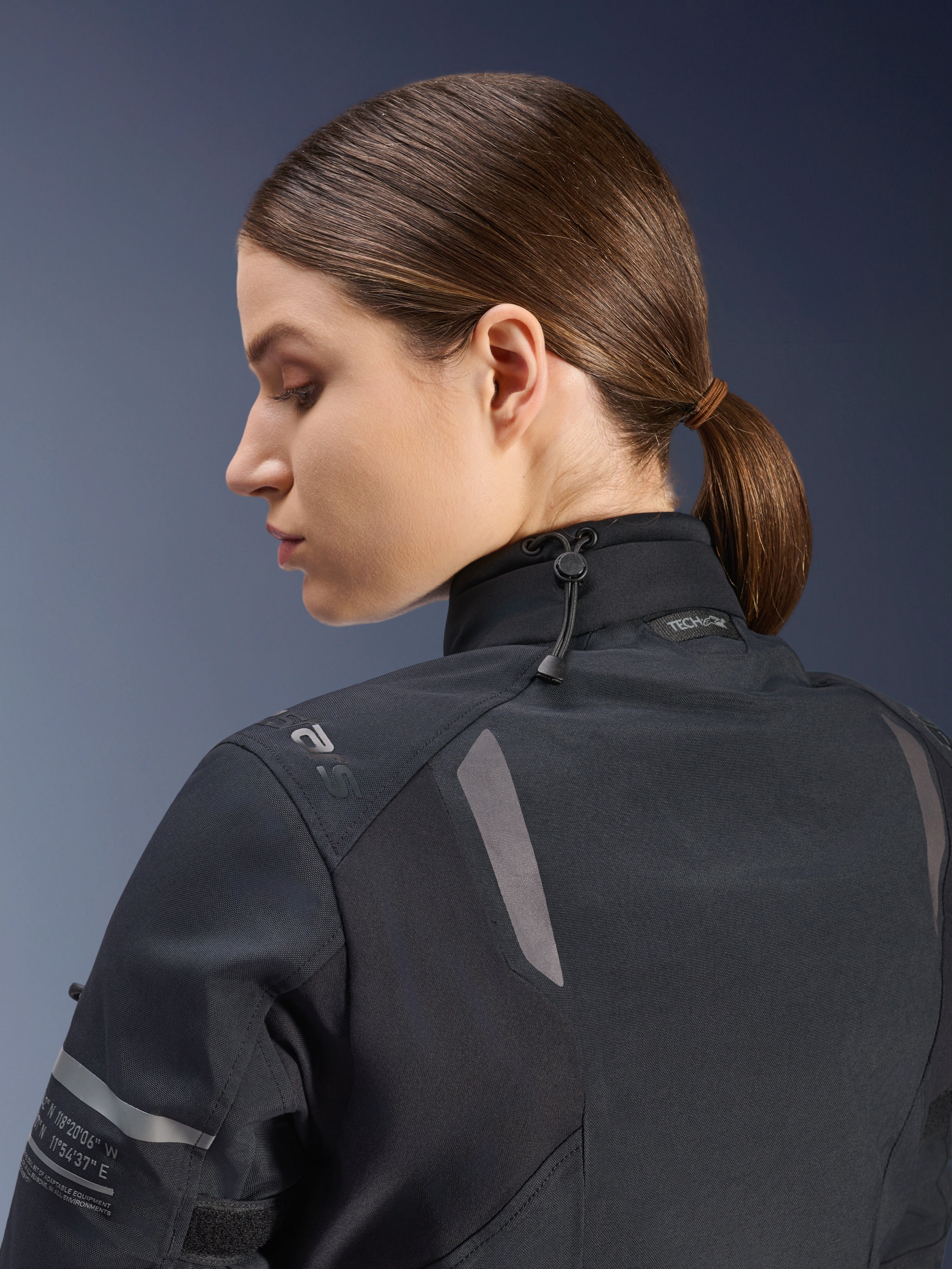 Alpinestars Women Stella ST-7 2L GORE-TEX Jacket, Motorcycle Jacket, Black, side-back view showing adjustable neck closure with shock cord, reflective shoulder accents, and Tech-Air Ready branding, functional design for adventure touring