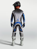 Alpinestars Supertech Hiten AFD Pants, men's motocross racing gear in blue and white, athletic rear view.
