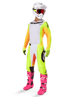Alpinestars 2025 Techstar Melt Gear Set, complete motocross racing outfit, white jersey with yellow and orange sleeves, neon yellow pants, bright pink boots, white helmet with red goggles, yellow gloves, vibrant colorful racing apparel