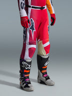 Alpinestars 2026 Racer Portl Pants, Motocross Pants, Red Light Gray and Dark Gray, worn with matching red gloves and multi-colored motocross boots, featuring bold Alpinestars logos and reinforced panels for off-road racing.