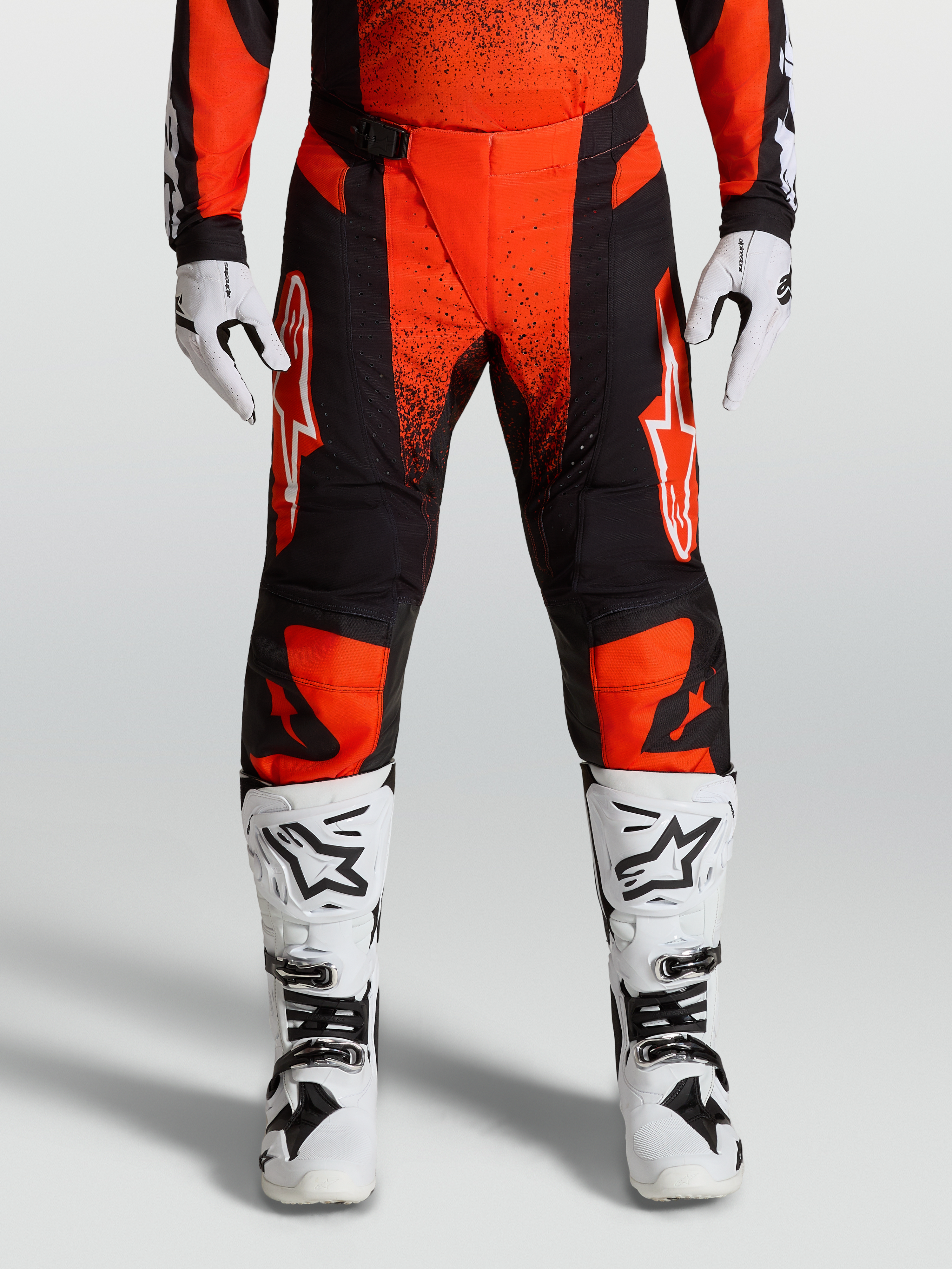Alpinestars Techstar Swan Motocross Pants, Cardinal Red and Black, Cardinal Red with white race boots and gloves.