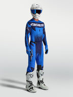 Alpinestars Techstar Swan Pants, blue and navy men's motocross gear, shown with matching jersey and white racing boots.