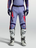 Alpinestars Racer Air Hunt Motocross Pants in light violet and deep purple with pink fluo accents, worn with white boots.