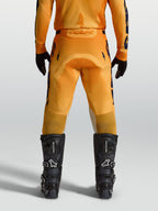 Alpinestars Racer Amber Pants, Men's Motocross Pants in Orange and Deep Blue, featuring a durable reinforced seat.