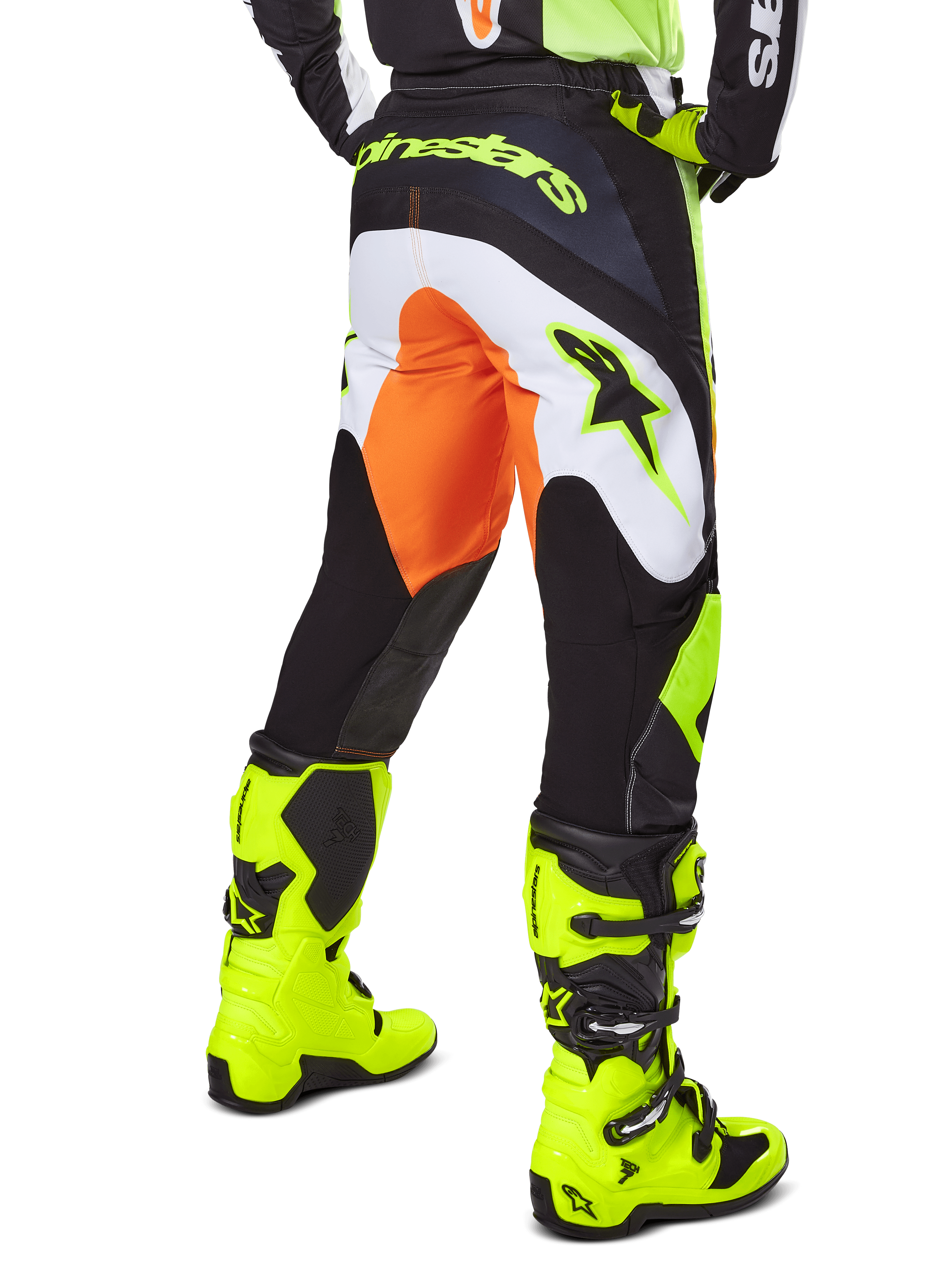 Alpinestars 2025 Fluid Wurx Pants, Motocross Pants, Yellow and Black with orange and white accents, back view worn with matching bright yellow boots, durable construction with bold branding for dirt bike riding