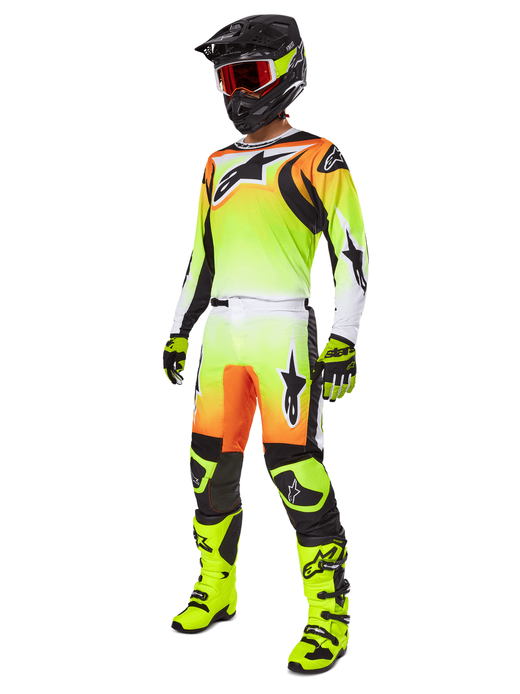 Motocross rider wearing the Alpinestars 2025 Fluid Wurx Pants in Yellow and Black, featuring a vibrant yellow-to-white gradient with orange and black accents, shown as part of a complete racing gear set with a matching jersey, black helmet, and neon yellow boots.