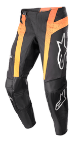Alpinestars 2023 Techstar Sein Pants, Motocross Pants, Black and Hot Orange, featuring vertical orange panels with perforated ventilation, reinforced leather knee areas, silver logos on the thighs and shins, and a race-fit design.
