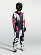 Alpinestars Fluid Drag Pants, men's motocross racing gear set in black and white with red fluo accents.