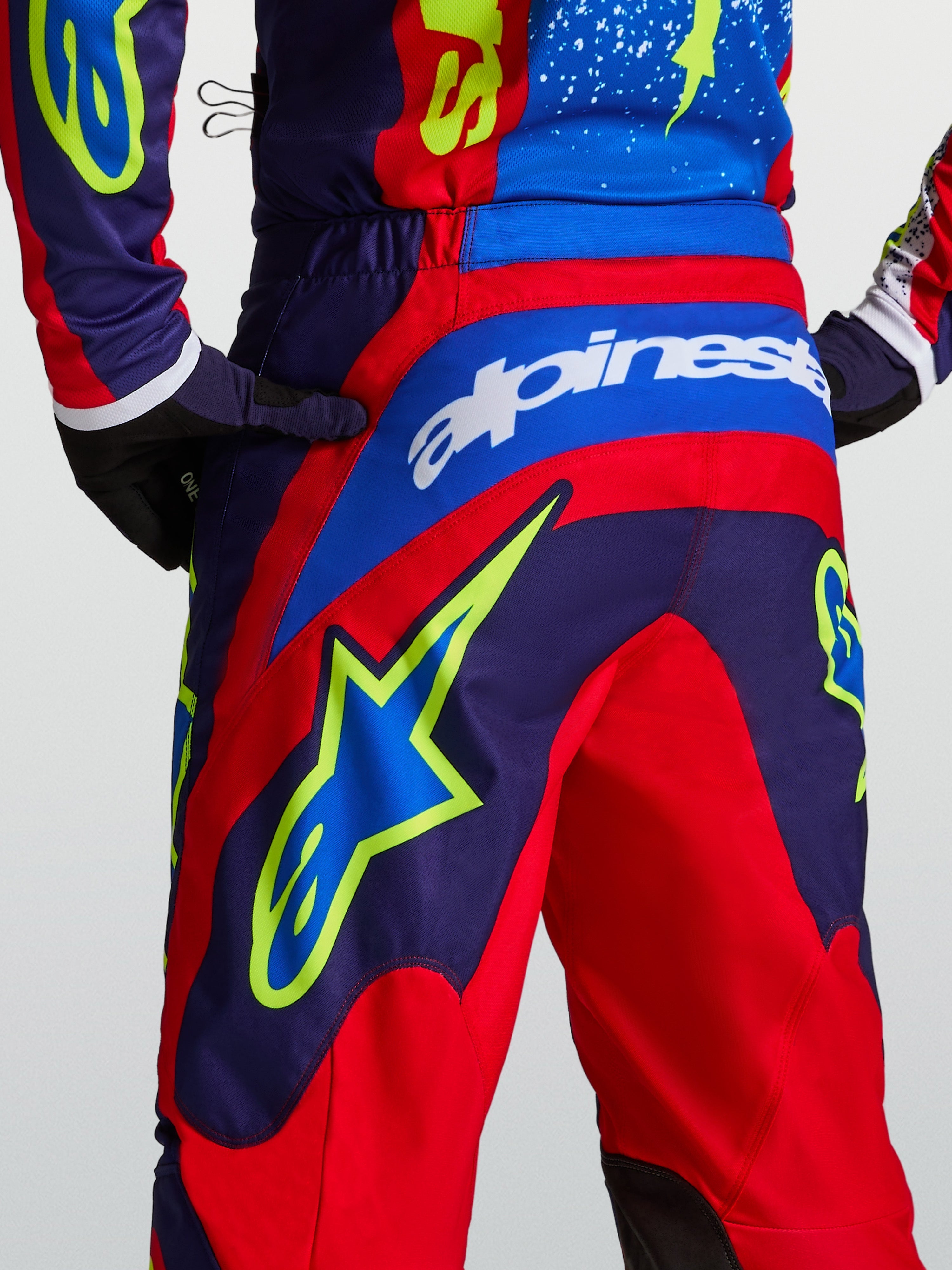 Alpinestars Fluid Drag Motocross Pants in Blue Navy and Fire Red with rear star graphics and a performance sport fit.