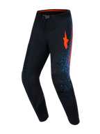 Alpinestars Supertech Black Hole Motocross Pants, professional black racing gear with red and blue burst graphics.