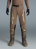 Alpinestars Limited Edition Supertech Air Gold Pants, Brown and Gold Motocross Gear on-model with Tech 10 boots.