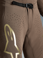 Alpinestars Supertech Air Gold Motocross Pants, Brown and Gold, ventilated stretch fabric with SX1 magnetic buckle.