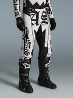 Alpinestars Limited Edition Techstar Wolf Dust Pants, black and white motocross gear with graphic print and athletic fit.