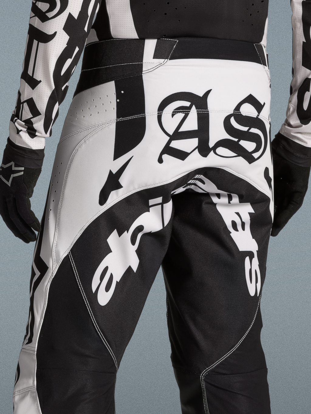 Alpinestars Limited Edition Techstar Wolf Dust Motocross Pants in Black and White with Gothic AS branding and vented panels.