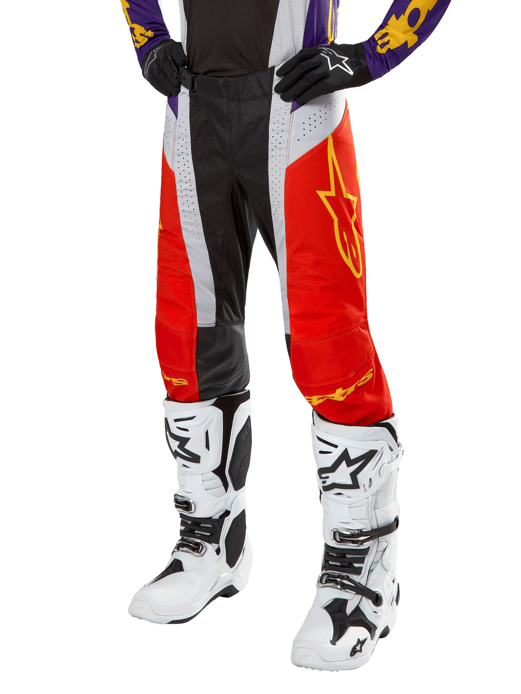Alpinestars 2024 Techstar Ocuri Pants, Motocross Racing Pants, Hot Orange, Black, and White with Yellow Star Graphic, worn with purple jersey and white boots, durable performance gear for off-road competition