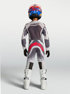 Alpinestars Youth Supertech Swan Pants, gray and red fluo youth motocross racing gear shown from the rear.
