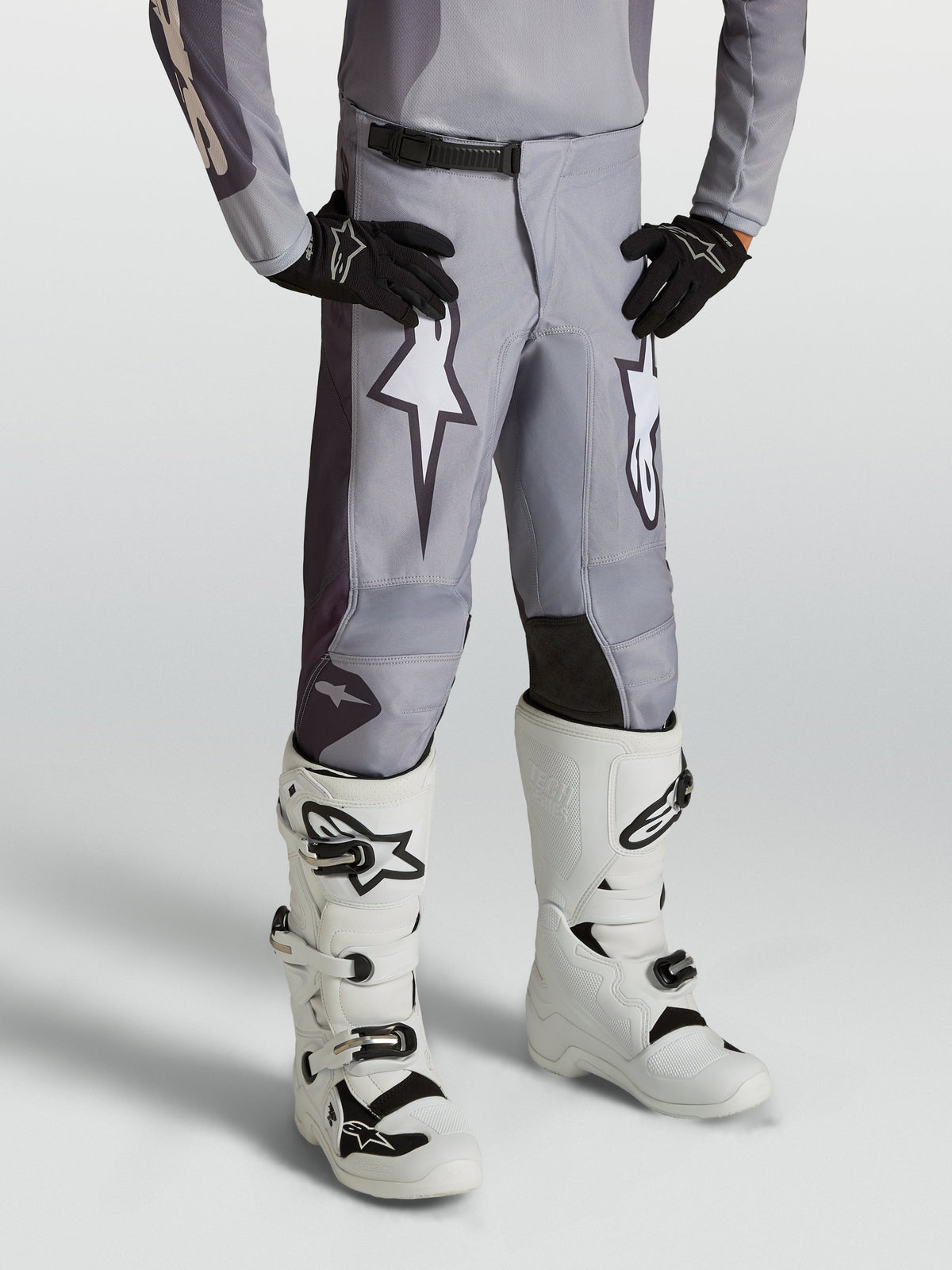 Alpinestars Youth Fluid Amber Pants, sand gray youth motocross pants with white star graphics and reinforced panels.