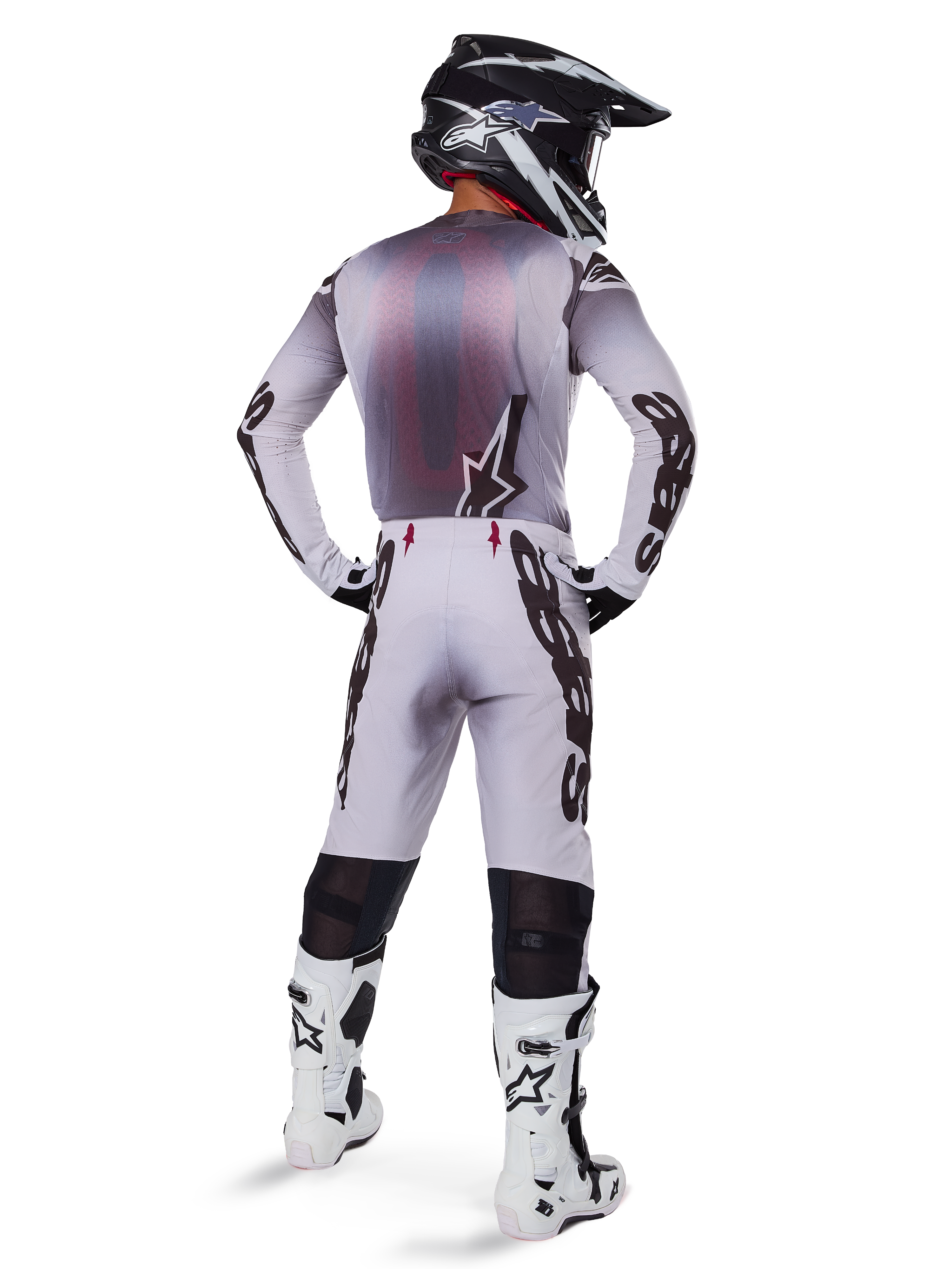 Alpinestars 2025 Supertech Maker Jersey, Motocross Jersey, Silver and Black, rear view on a rider wearing matching gear and white boots, featuring bold Alpinestars branding on sleeves and a star logo on the back, athletic race fit for professional off-road performance.