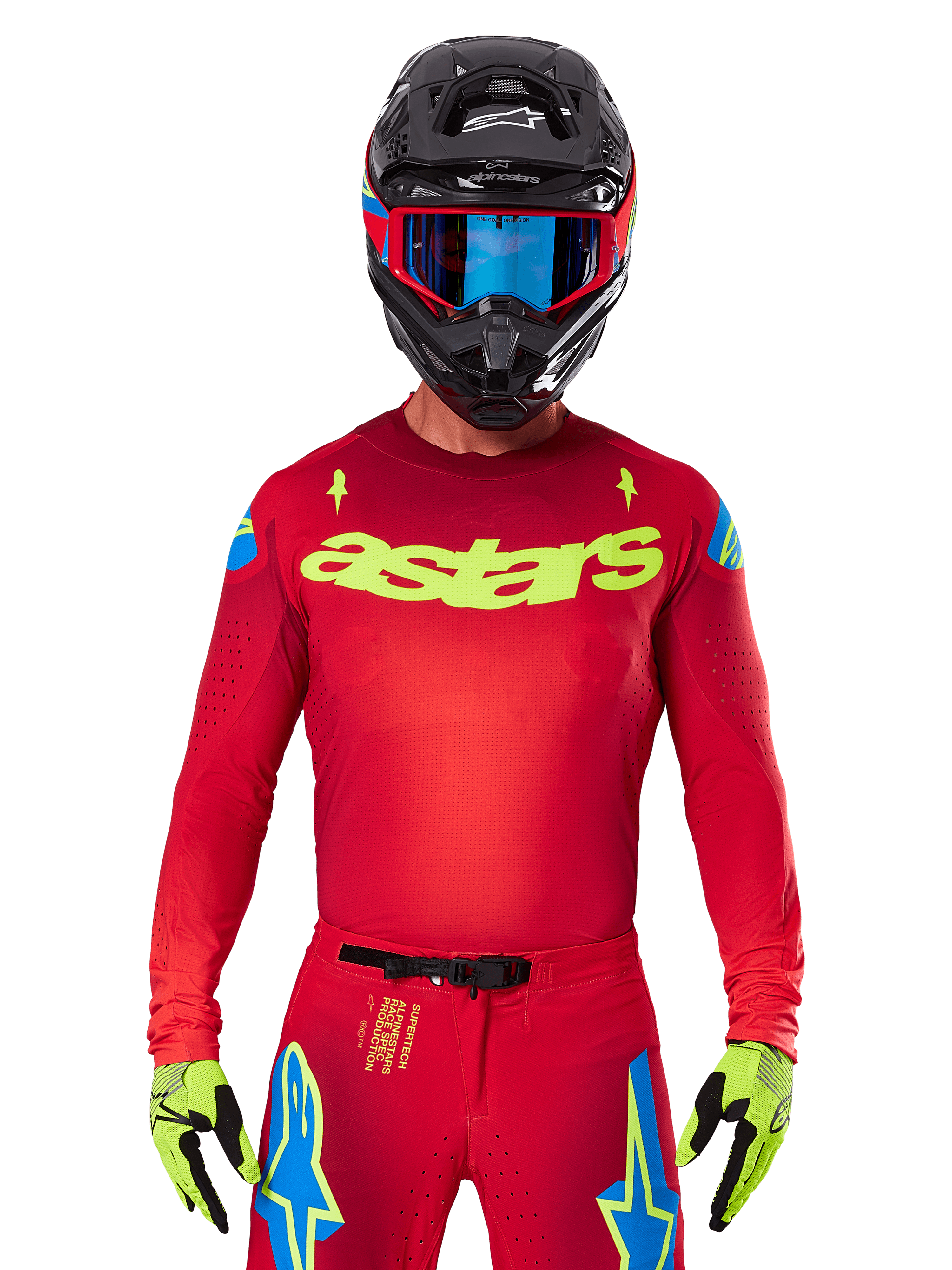 Alpinestars 2025 Supertech Maker Jersey in Bright Red Yellow Fluo, featuring yellow 'astars' chest branding and blue star shoulder designs, worn with matching pants, black helmet, blue goggles, and yellow gloves, professional motocross racing apparel