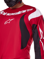 Alpinestars 2025 Fluid Haul Jersey and Gear Set, red and black motocross top with white logos and athletic design.