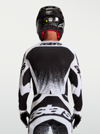 Alpinestars Techstar Swan Men's Motocross Jersey, Black and White, rear view showing athletic race fit and graphic detail.