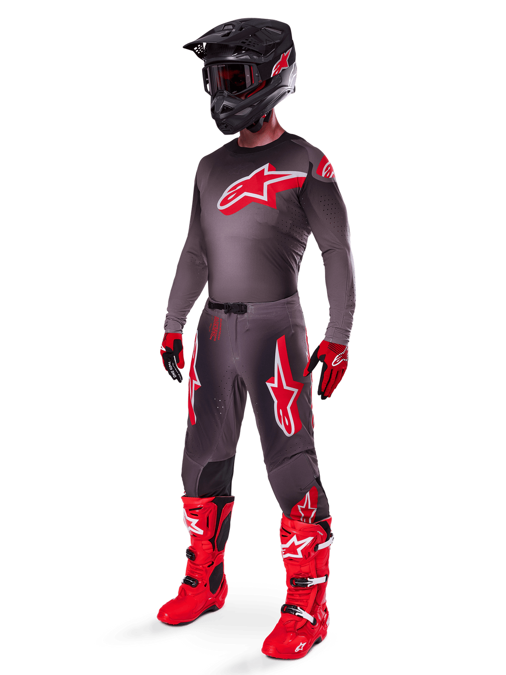 Motocross rider wearing complete racing gear, Smoke Bright Red 2025 Supertech Lipan Jersey, matching grey pants with red graphics, black helmet with red accents, bright red boots, and red and black gloves, coordinated professional outfit for off-road racing