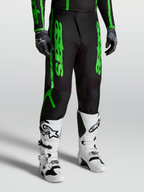 Alpinestars Fluid Apex V2 Pants, men's motocross performance gear in black and fluorescent green with reinforced 600D polyfabric.