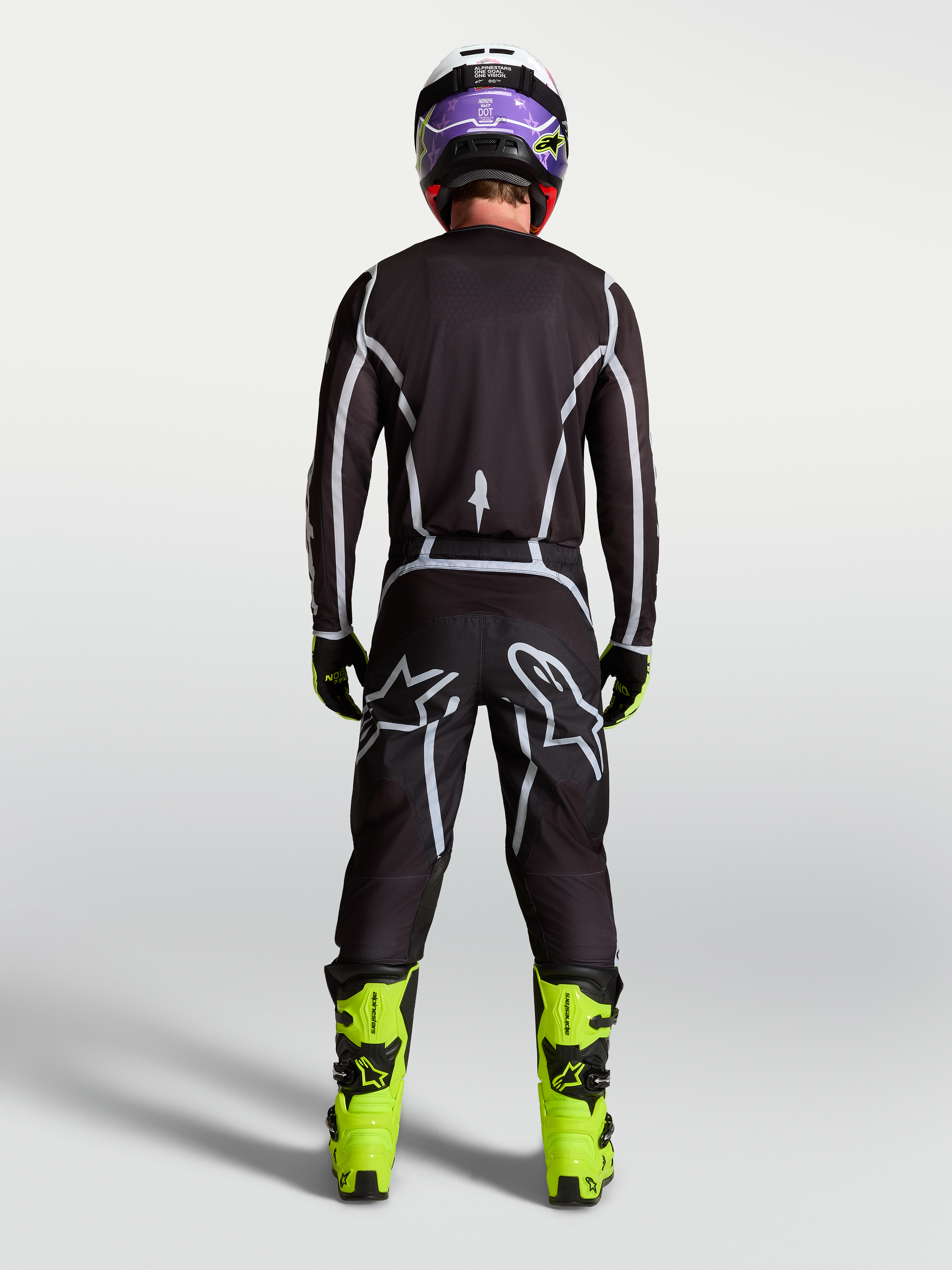 Alpinestars Fluid Apex V2 Jersey, Men's Motocross Gear, Black and Silver, rear view on rider in full racing kit.