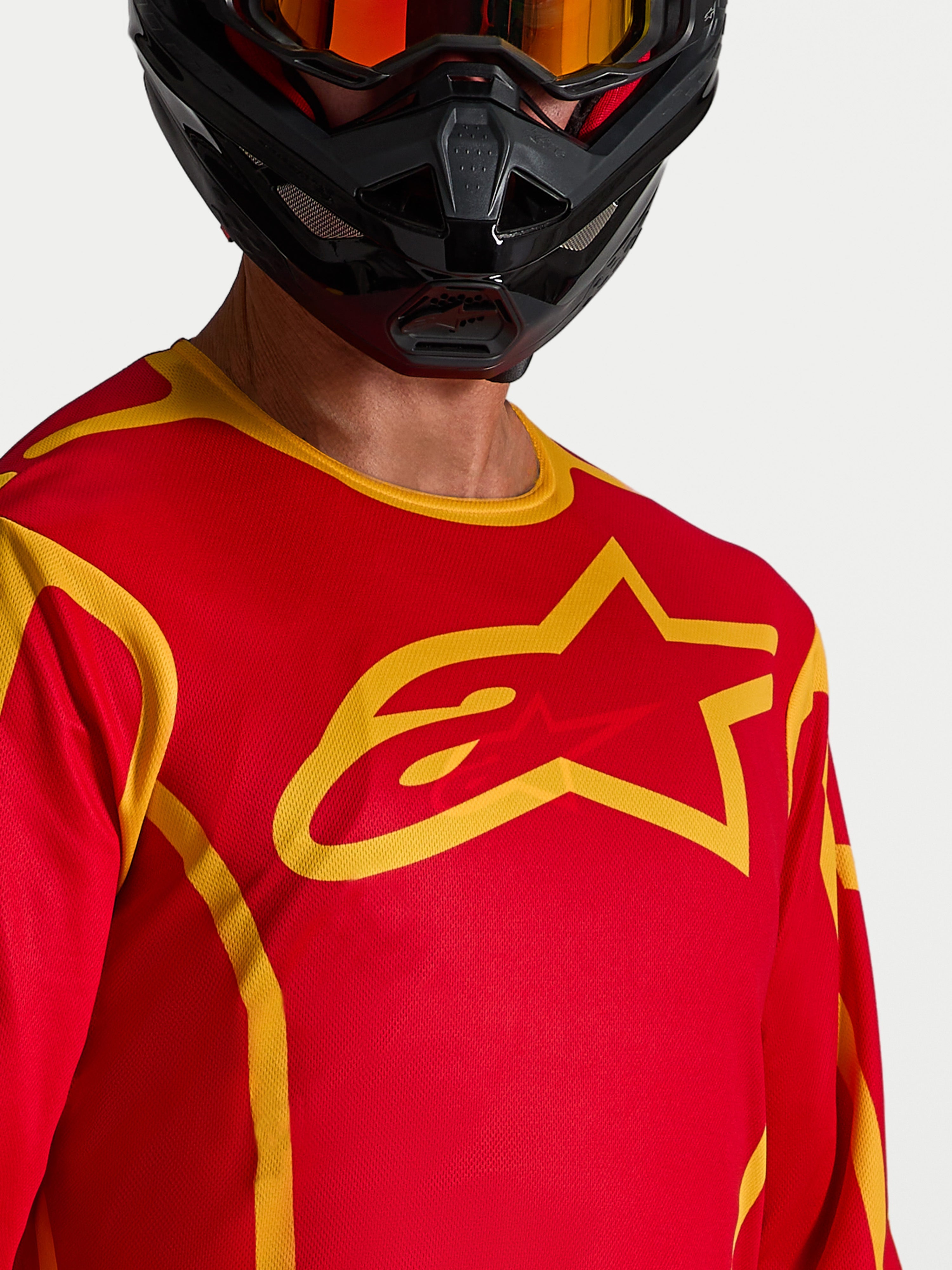 Alpinestars Fluid Apex V2 Jersey in Red and Gold, a moisture-wicking men's motocross jersey with a large chest star logo.