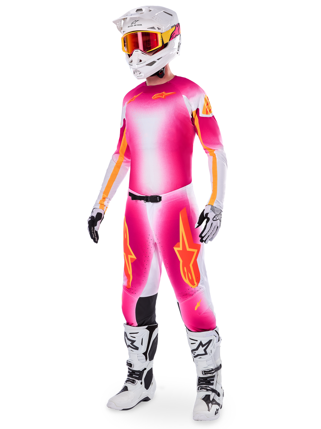 Motocross rider wearing the Limited Edition Supertech AFD MIG Jersey and matching pants, Pink Fluo and White with orange branding, paired with a white helmet, red goggles, and white boots, complete professional off-road racing gear