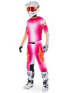 Motocross rider wearing the Limited Edition Supertech AFD MIG Jersey and matching pants, Pink Fluo and White with orange branding, paired with a white helmet, red goggles, and white boots, complete professional off-road racing gear