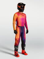 Alpinestars Fluid Kepler Jersey, purple and orange motocross jersey on-model with matching racing gear.