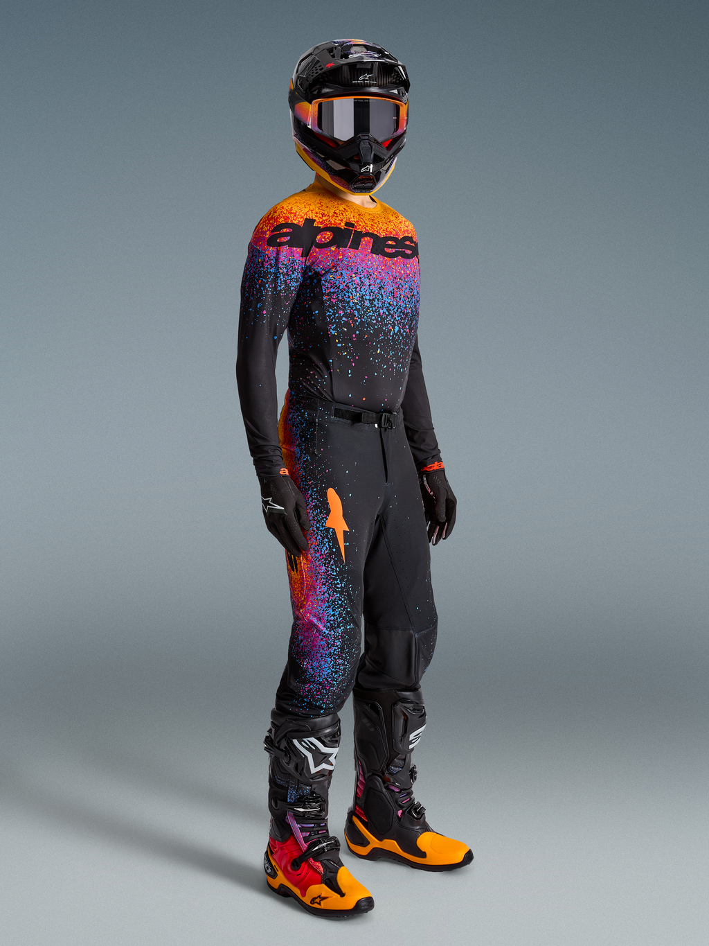 Alpinestars Limited Edition Supertech Black Hole Jersey, Motocross Racing Gear Set in Black with Orange and Purple Accents.