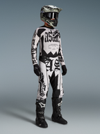 Alpinestars Limited Edition Techstar Wolf Dust Jersey, Dune and Black motocross racing gear with gothic-style lettering.