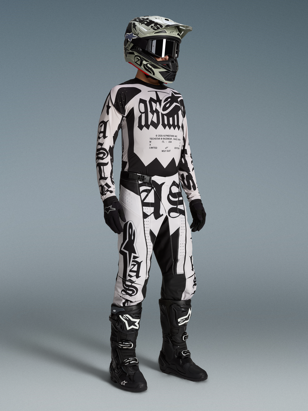 Alpinestars Limited Edition Techstar Wolf Dust Gear Set AND Pants, black and white motocross racing apparel on model.