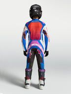 Alpinestars Youth Supertech Maven Motocross Gear Set, Blue and Hot Coral racing jersey and pants, rear view on model.