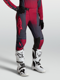 Alpinestars Stella Techstar Swan Pants, women's motocross gear in gray and crimson red, worn with Tech 10 white boots.